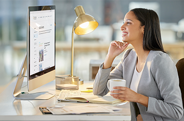 woman working at a computer; looking at the NCSBN events page